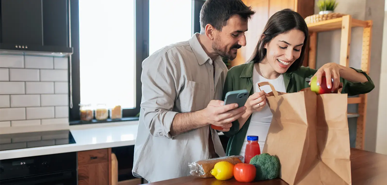 Couple unpacking groceries Couple unpacking groceries